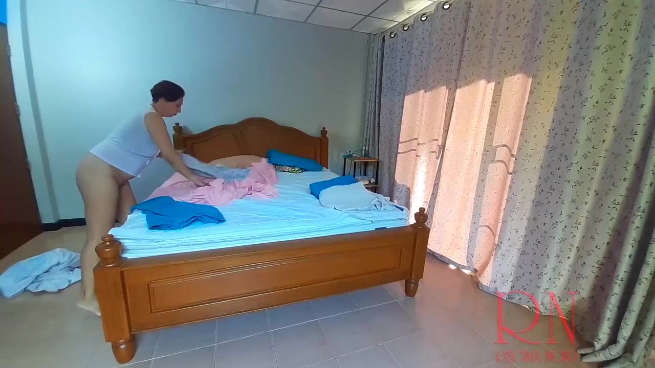 Curvy Housekeeper Regina Noir Tidies Up in the Nude: A Seductive Peek into Nudist Life