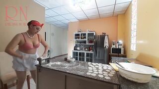 Curious Housewife Bra 1 Cooks Dinner in the Nude: A Playful Peek into Her Kitchen