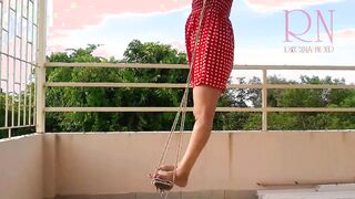 Charming Housewife Enjoys a Playful Swing in the Nude - A Retro Pin-Up Delight