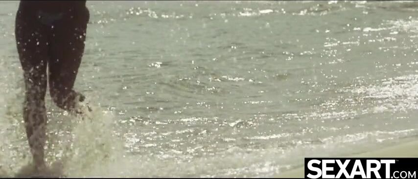 Watch these gorgeous beach babes enjoy passionate lesbian sex