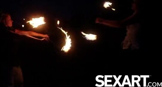 Gorgeous girls lick each other's pussy under the stars in Tahiti