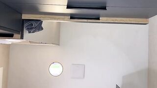 Sexy and hot horny MILF wife in see through top flashes her big boobs in a leather mini skirt in the bathroom