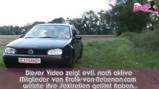 German babe enjoys public sex in a field with her partner, featuring hardcore action.