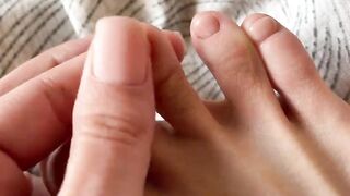 Toes with beige pedicure