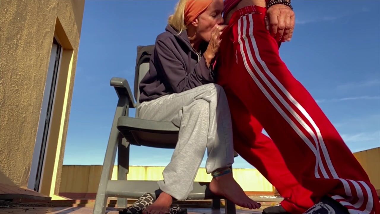 Steamy Outdoor Encounter: Watch This Hot Milf Satisfy Her Neighbor on the Terrace!