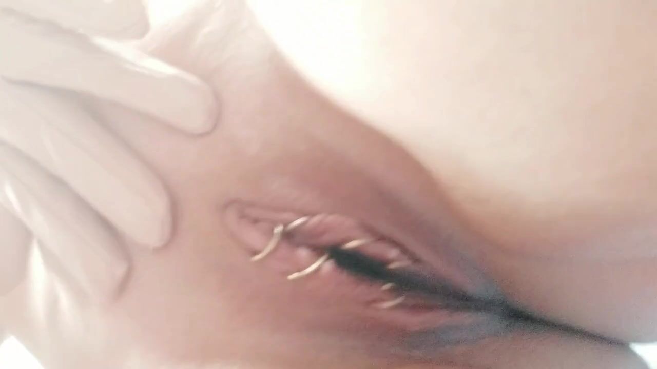 Curvy MILF Teases in Shiny Vinyl: Captivating Selfie Moments!