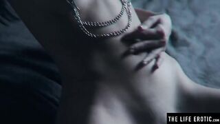 Watch this kinky brunette with massive tits pleasure herself with hot wax and a hard orgasm