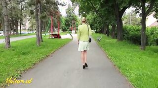 Watch Mazzy Leggz, a stunning blonde MILF with long legs, flash in the park in high heels and undress