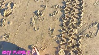 ShyFamily fisting her best friend's pussy at nude beach while people watch!