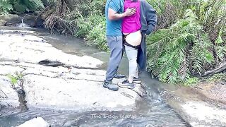 Charming Couple Enjoys a Romantic Moment by the River - Adventurous Outdoor Connection