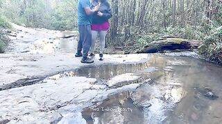 Charming Couple Enjoys a Romantic Moment by the River - Adventurous Outdoor Connection
