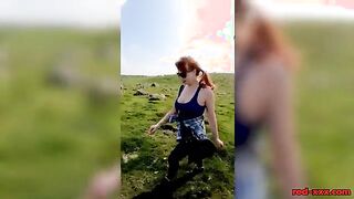 Busty Redhead Enjoys a Topless Stroll in Nature This Easter!