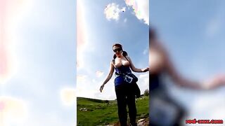 Busty Redhead Enjoys a Topless Stroll in Nature This Easter!