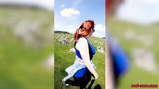Busty Redhead Enjoys a Topless Stroll in Nature This Easter!