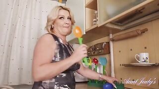 Linetta's Kitchen Tease: Busty 52-Year-Old MILF in Action!