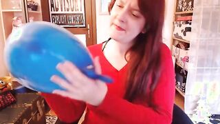 Experience the Thrill: Watch Nicoletta Embassi Play with a Big Blue Balloon!