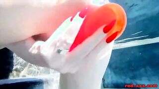 Red XXX Enjoys a Playful Pool Session with a Toy!