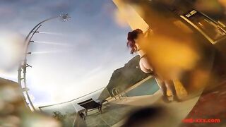 Mature Redhead Enjoys a Playful Moment by the Poolside