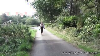 Sonia's Outdoor Adventure: A Playful Flash and Sensual Moment in Nature